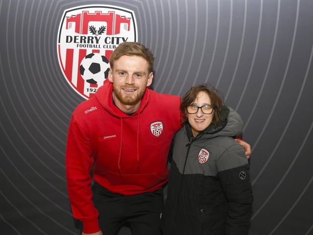 Candystripe fan Clare McCarron pictured with Derry City's Rob Slevin at the club'™s merchandise outlet in Foyleside Shopping Centre. Photo: George Sweeney