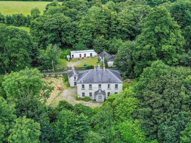 Brookhill House, 33 Ardlough Road is for sale at £650,000. The detached country residence was built around 1795 and comes with 35 acres of land. The house boasts seven bathrooms, three reception rooms and three bathrooms.:Brookhill House on the Ardlough Road.