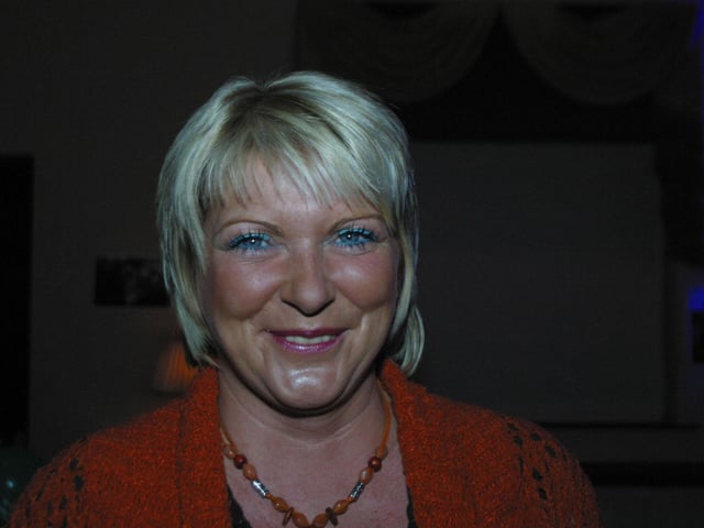 Anita gives a smile for the camera after getting over the shock of the surprise party. 158dd