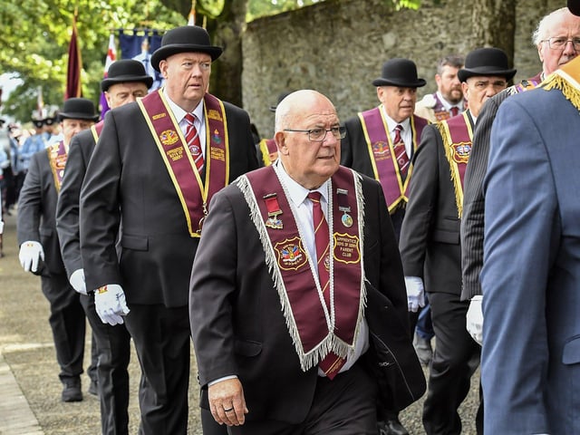 William Hay, former Speaker of the Northern Ireland Assembly, takes part in the ‘Derry Day’ parade on Derry’s Walls on Saturday morning. Photo: George Sweeney
