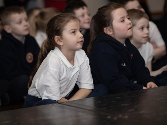 Young pupils at Holy Child PS enthralled by the stage performance on Wednesday.