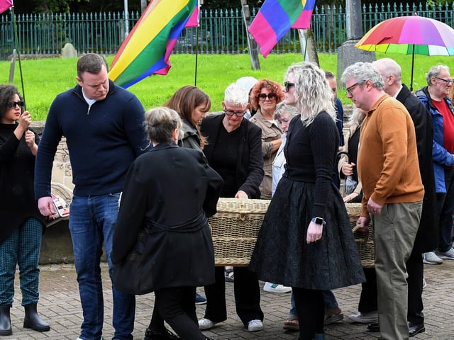A wicker coffin, containing the remains of journalist and activist Nell McCafferty, is brought to the Long Tower Church for Requiem Mass on Friday afternoon.  Photo: George Sweeney
