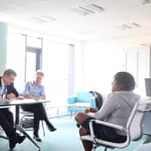 Twelve-year-old TJ Mushapho telling Steve Baker MP about his experiences as black child growing up in Derry. Listening on are North West Migrants Forum Director Lilian Seenoi Barr and Daniel Holder of the Committee on the Administration of Justice (CAJ).