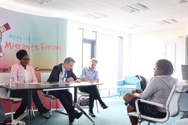 Twelve-year-old TJ Mushapho telling Steve Baker MP about his experiences as black child growing up in Derry. Listening on are North West Migrants Forum Director Lilian Seenoi Barr and Daniel Holder of the Committee on the Administration of Justice (CAJ).