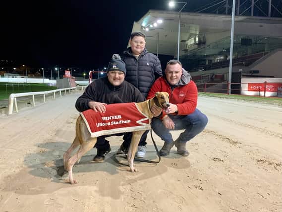 Conlig Maggie who secured a third consecutive victory pictured with her owner/trainer Charles Coyle and his sons Shane (centre) and Nathan.