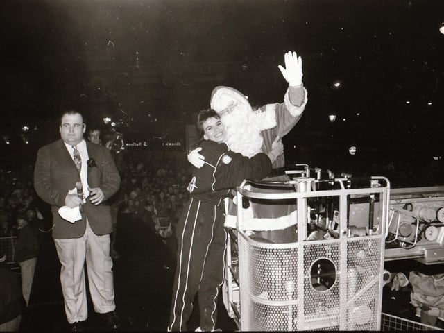 Santa, with help from TV Gladiator Falcon, also known as Bernadette Hunt, switched on the Derry Christmas lights.