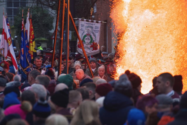 Apprentice Boys and supporters watch as an effigy of Robert Lundy burns in Bishop Street.