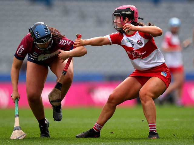 Derry’s Aine McGill and Julie McLoughlin of Westmeath battle for possession during Sunday's Very Camogie League Division 2A Final in Croke Park. (Photo: INPHO/Ryan Byrne)