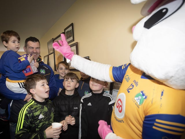 Paul McKinney introduces his young son to the Easter Bunny at Beart on Saturday.