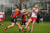 Down pair Matt Conlon and John McManus tackle Derry’s Shea Cassidy last week at Owenbeg. Photo: George Sweeney