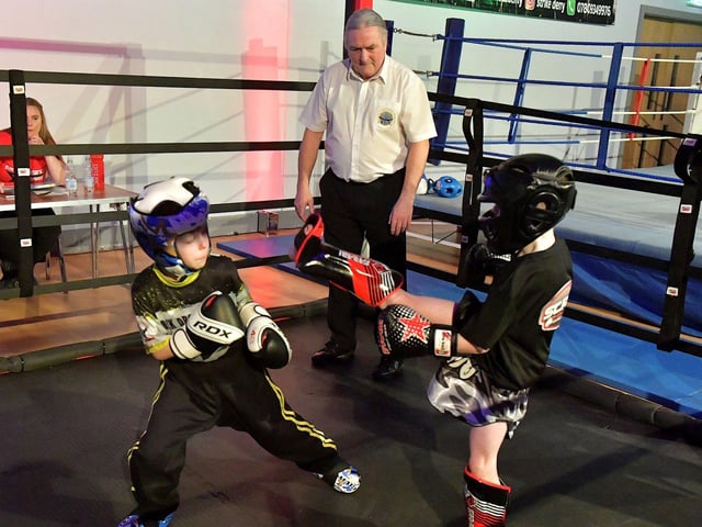 Oisin O’Hagan (left), Strike Martial Arts, takes on Andrew Lychenko, Black Dragan Cavan, in The Rising Stars event held in Shantallow Community Centre on Saturday. Photo: George Sweeney. DER2308GS – 156
