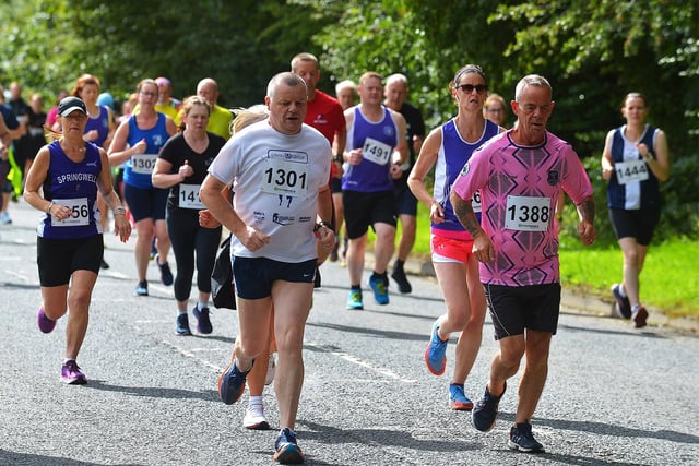 Benny Barber (1301) and Barry McQuaid (1388) taking part in the Eglinton Runners charity 5K race at Campsie on Sunday morning. Photo: George Sweeney. DER2331GS - 14