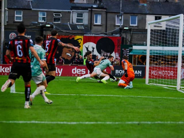 Robbie Benson goes down under the challenge of Bohs' Niall Morahan late in the game at Dalymount Park. Photo: Kevin Moore.