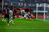 Robbie Benson goes down under the challenge of Bohs' Niall Morahan late in the game at Dalymount Park. Photo: Kevin Moore.