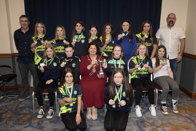 The Mayor of Derry City and Strabane District Council, Patricia Logue presenting the Winter Cup to Sion Swifts Flames u-12s.. Included are coaches Mark Patton and Gerard Tourish.