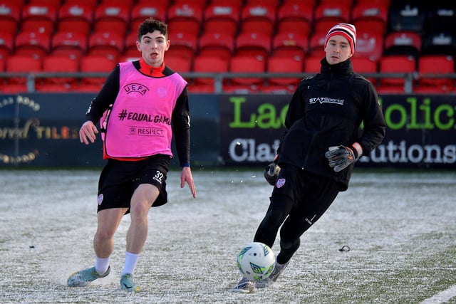 Derry City goalkeeper Brian Maher coolly passes the ball before youngster Sean Patton could challenge, during Monday's training session at the Brandywell Stadium. Picture: George Sweeney. DER2304GS – 09