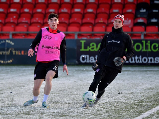 Derry City goalkeeper Brian Maher coolly passes the ball before youngster Sean Patton could challenge, during Monday's training session at the Brandywell Stadium. Picture: George Sweeney. DER2304GS – 09