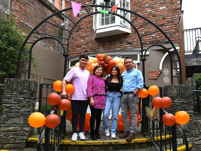 Proprietors Joseph and Ralyn Petingco with their children Jason Paul and Hannah at the opening of Derry's first Filipino restaurant, called Bahay Kusina, in the Craft Village, on Saturday afternoon. Photo: George Sweeney