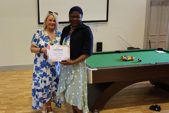 Collecting a certificate on behalf of Bintan Ashorobi is Idowu Alli.
