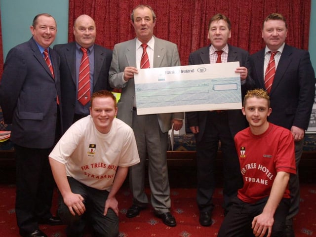 Johnny Kelly (second from right) of the Fir Trees Hotel, presenting a cheque ot Felix McCrossan, treasurer of Tyrone Milk Cup committee for sponsorship of this years Milk Cup squad.  Also in photo are Sean Curneen, Chairman Tyrone Milk Cup committee, Danny Rouse Manager of Strabane FC and Marty Gamble. at front are squad members James McAnenny and Darren Gamble.  (0402JB01)