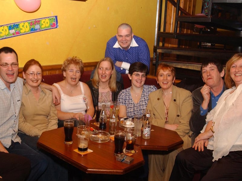 Liz McCauley, (middle) with some of her workmates who came to celebrate her 50th birthday at the Linen hall. Included are, Chris McIntyre, Patrick McGilloway, Martin and Shaun Kemish, Cathy Deliveavy, Ann McKay, Donna McGilloway, Liz Gallagher and Kate Rooney.
