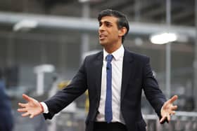 Rishi Sunak talks to local business leaders during a visit to a Coca-Cola factory in Lisburn, Northern Ireland yesterday (Picture: Liam McBurney/WPA pool/Getty Images)