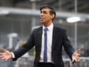 Rishi Sunak talks to local business leaders during a visit to a Coca-Cola factory in Lisburn, Northern Ireland yesterday (Picture: Liam McBurney/WPA pool/Getty Images)