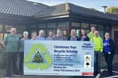 Staff and volunteers launching the Christmas Tree Recycling Scheme.