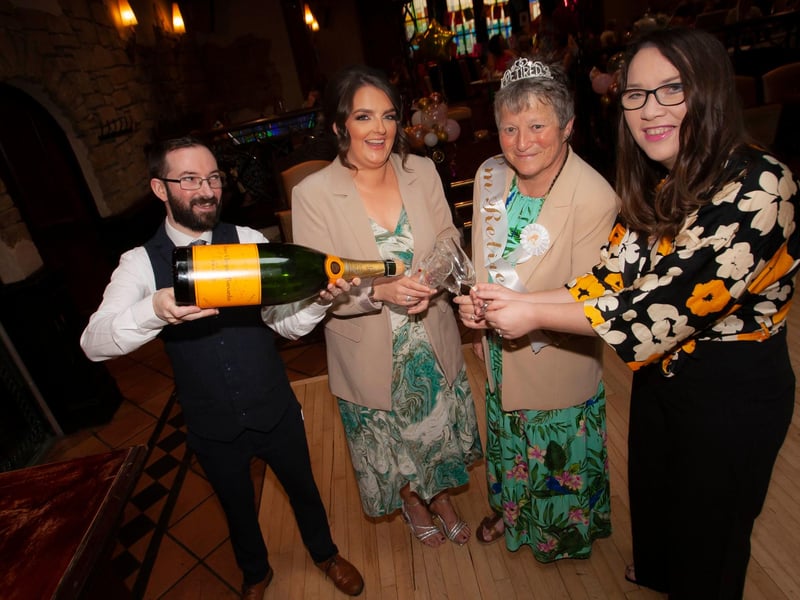 A glass of bubbly for the retiring teacher and some colleagues.