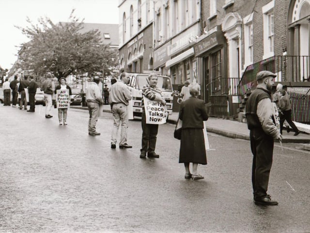 Sinn Féin's Martin McGuinness, Mary Nelis and other party members leading protests calling for all party peace talks.