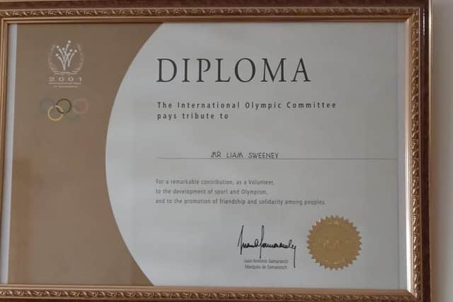 On a wall in a house in Derry hangs a plaque from the International Olympic Committee that reads – ‘To Liam Sweeney for your remarkable contribution as a volunteer to the development of sport and Olympism and to the promotion of friendship and solidarity among peoples.’