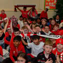 Pupils from Good Shepherd Primary School gave a rapturous welcome to Derry City players Mark Connolly, Liam Mullan and Jack Lemoignan during a visit to the school, with the FAI Cup, on Friday afternoon. Photo: George Sweeney. DER2247GS – 97