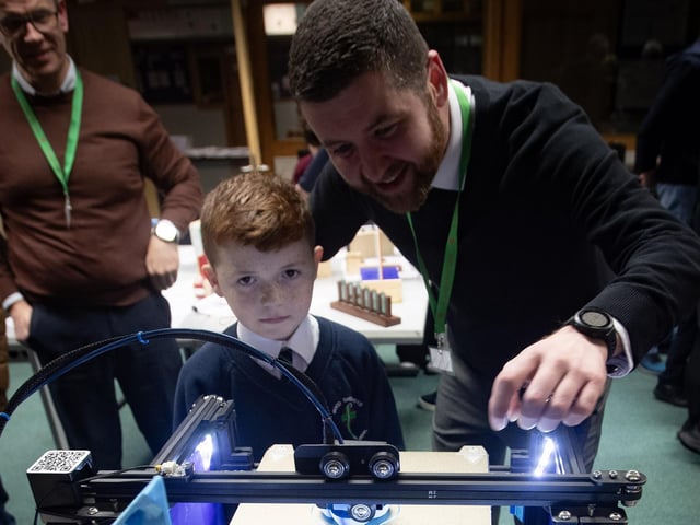 Good Shepherd PS pupil Ronan Walker gets shown some of the top of the range equipment at St. Joseph's Boys School by teacher Mr. Gary Clarke during Tuesday's Open Night. (Photos: Jim McCafferty Photography)