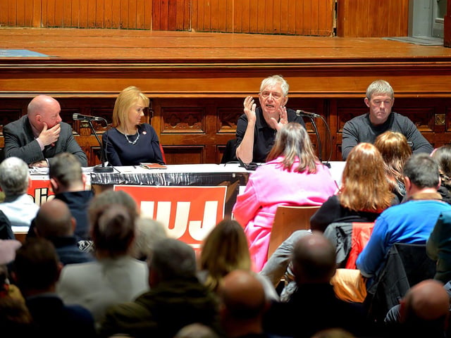 National Union of Journalists president Pierre Vicary addressing the attendance at a public meeting, held in the Guildhall on Wednesday evening, opposing proposed cuts to jobs and services at BBC Radio Foyle. Included in the photograph are Séamus Dooley NUJ assistant general secretary, Felicity McCall journalist, writer and broadcaster and Niall McCarroll, chair of Derry Trades Union Council. George Sweeney. DER2301GS – 24
