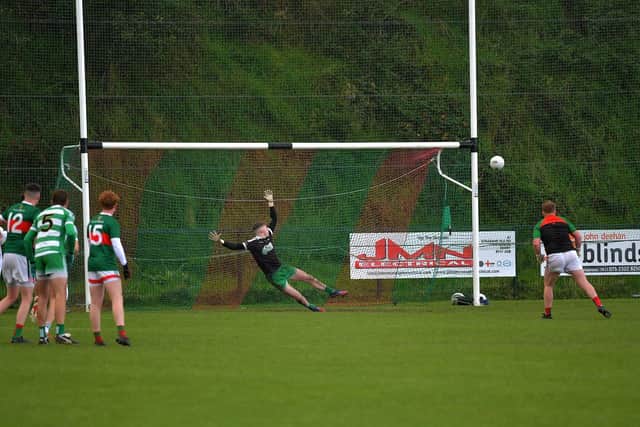 Slaughtmanus goalkeeper Kevin Duddy sees his first half penalty strike the post against Faughanvale during Saturday’s IFC Relegation Playoff at Doire Trasna. Photo: George Sweeney
