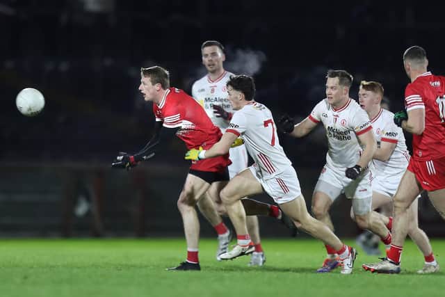 Derry's Brendan Rogers gets away from Shea O'Hare of Tyrone during the Division One match in Healy Park.