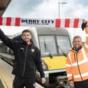 Derry City goalkeeper, Tadhg Ryan, along with Stephen Boyd, Senior Customer Service Coordinator at Translink.