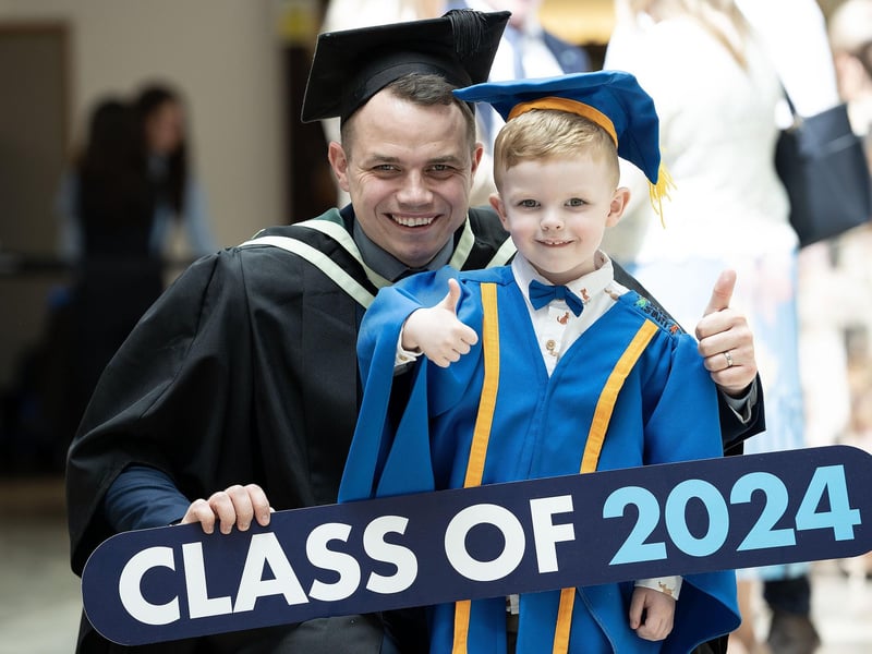 Michael Morrison (aged 3) celebrates with dad Gary Morrison, from Derry, who graduated with a PGCE in Further Education from Ulster University in Derry on Monday July 8. (Photo: Nigel McDowell / Ulster University)