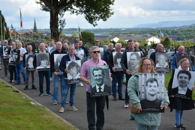 Family members carry portraits of republicans killed in the conflict during the Derry Volunteers Sunday commemorations.