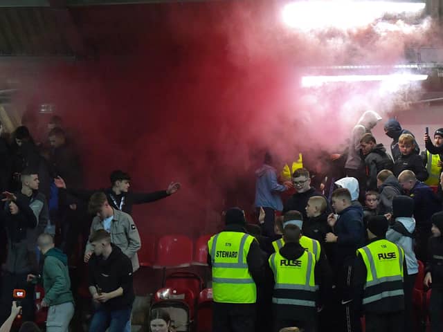 A flare is set of by Derry city supporters at a recent match at Brandywell. Photograph: George Sweeney