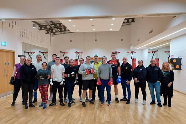 Participants, trainers, organisers and CALMS representatives at St Mary's ABC in Creggan on Wednesday night ahead of the CALMS Fight Night at the Guildhall.