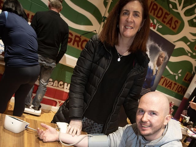 BBHF's Elaine Doherty carrying out a BP check on Aaron Ward during Tuesday night's health event in Sean Dolan's GAC, Creggan. (Photos: Jim McCafferty Photography)