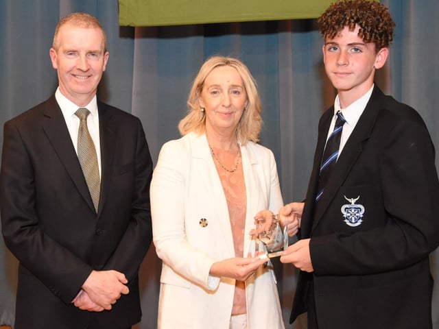 St. Columb’s College Year 9 Sportsman of the Year 2022-2023 Adam Green 9D receives his awrd from Mrs M. Burns, Yead Head and Senior Teacher. On left is Mr FJM Madden, Principal.