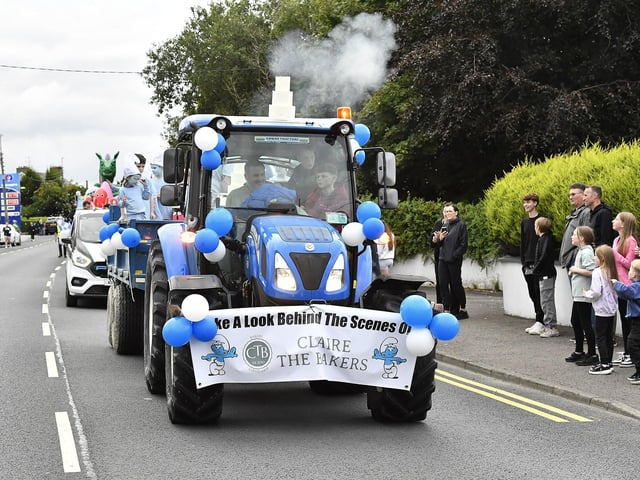 Muff Feile opening parade makes its way through the village on Friday evening. Photo: George Sweeney