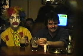 A picture of two men, one dressed up for Halloween and another not, from Debs Boyle's book 'Welcome to Halloween Town'.