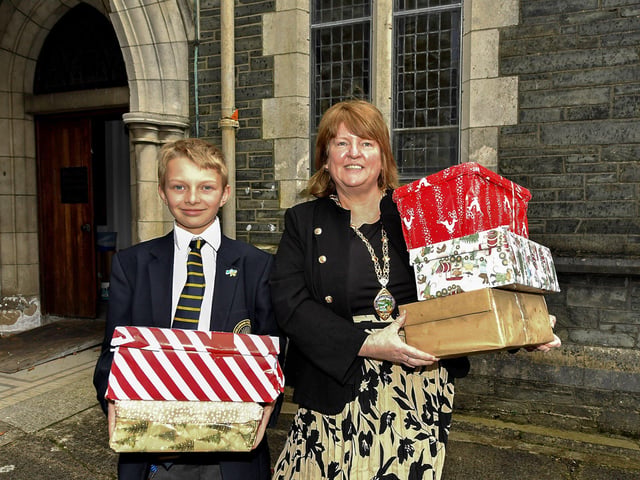 Twelve year old Volodymyr Vorona, from Ukraine and a pupil of Lumen Christi College pictured with Deputy Mayor Alderman Niree McMorris during the recent collection of Christmas presents for Ukrainian children, by Derry Ukraine Aid’s Peter Jennings. Photo: George Sweeney
