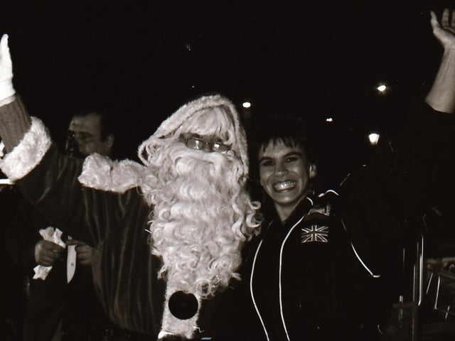 Santa, with help from TV Gladiator Falcon, also known as Bernadette Hunt, switched on the Derry Christmas lights.