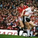 Steve Nicol of Liverpool is challenged by Norman Whiteside of Manchester United during a First Divsion match at Old Trafford on October 9, 1985 in Manchester, England. (Photo by Mike King/Allsport/Getty Images)