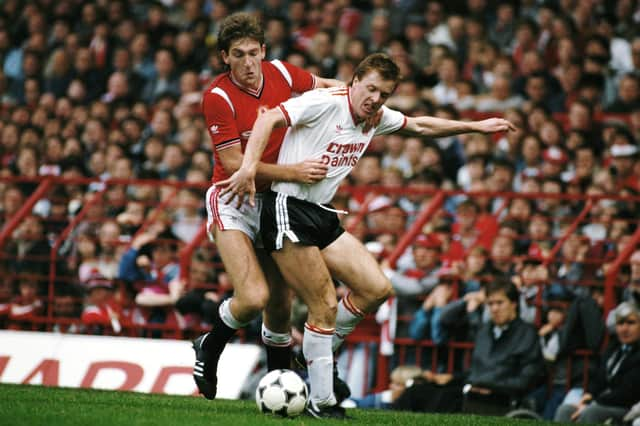 Steve Nicol of Liverpool is challenged by Norman Whiteside of Manchester United during a First Divsion match at Old Trafford on October 9, 1985 in Manchester, England. (Photo by Mike King/Allsport/Getty Images)