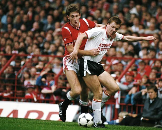 Steve Nicol of Liverpool is challenged by Norman Whiteside of Manchester United during a First Divsion match at Old Trafford on October 9, 1985 in Manchester, England. (Photo by Mike King/Allsport/Getty Images)